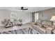 Bright living room featuring neutral walls, modern furniture, and lots of natural light at 51 Oakwood N Dr # 51, Englewood, FL 34223
