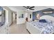 Spacious main bedroom with a king bed and serene blue color scheme at 51 Oakwood N Dr # 51, Englewood, FL 34223