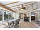Inviting sunroom with a ceiling fan and sliding glass doors leading to the outside at 51 Oakwood N Dr # 51, Englewood, FL 34223