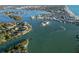 Breathtaking aerial view of a coastal community nestled along the bay, featuring waterfront homes and stunning scenery at 524 Lyons Bay Rd, Nokomis, FL 34275