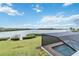 This backyard boasts a screened-in pool and beautiful lake views at 524 Lyons Bay Rd, Nokomis, FL 34275