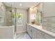 Well-lit bathroom with modern fixtures, spacious vanity, and glass-enclosed shower area at 524 Lyons Bay Rd, Nokomis, FL 34275