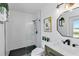 Modern bathroom with a glass-enclosed shower, sleek vanity, and contemporary fixtures at 524 Lyons Bay Rd, Nokomis, FL 34275