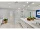 Bright bathroom featuring a glass enclosed shower, double sink vanity, and tiled floor at 524 Lyons Bay Rd, Nokomis, FL 34275