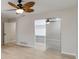 This bedroom offers a ceiling fan, light hardwood floors and a closet with mirrored sliding doors at 524 Lyons Bay Rd, Nokomis, FL 34275