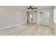 A serene bedroom features light wood floors, ceiling fan and mirrored closet doors at 524 Lyons Bay Rd, Nokomis, FL 34275