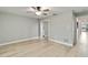 A spacious bedroom with light wood floors and a closet with sliding mirrored doors at 524 Lyons Bay Rd, Nokomis, FL 34275