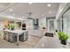 Well-lit kitchen featuring white cabinets, granite countertops, and stainless steel appliances at 524 Lyons Bay Rd, Nokomis, FL 34275