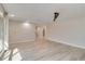 This living room boasts hardwood floors, a ceiling fan, and sliding glass doors that fill it with sunlight at 524 Lyons Bay Rd, Nokomis, FL 34275