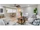 Bright living space with sleek floors, modern furniture, and an open view of the staircase at 524 Lyons Bay Rd, Nokomis, FL 34275