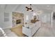 Spacious living room with vaulted ceilings, stone fireplace, and neutral decor at 524 Lyons Bay Rd, Nokomis, FL 34275