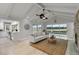 Bright and airy living room with water view, fireplace, modern decor, and open layout at 524 Lyons Bay Rd, Nokomis, FL 34275