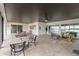 This covered outdoor patio offers a relaxing space for entertaining with plenty of seating at 524 Lyons Bay Rd, Nokomis, FL 34275