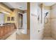 Well-lit bathroom with a tiled shower, separate soaking tub, and stylish vanity at 5550 Rock Dove Dr, Sarasota, FL 34241