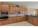 Well-equipped kitchen with custom cabinets and tile backsplash at 5550 Rock Dove Dr, Sarasota, FL 34241