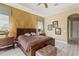 Comfortable main bedroom with tray ceiling, ceiling fan, and tasteful decor with great natural light at 5550 Rock Dove Dr, Sarasota, FL 34241
