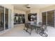 Covered patio featuring a table and chairs with views of the interior rooms at 5550 Rock Dove Dr, Sarasota, FL 34241