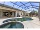 Inviting screened-in pool and hot tub with an outdoor seating area at 5550 Rock Dove Dr, Sarasota, FL 34241