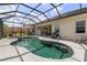 Gorgeous screened-in pool with a spa, and an outdoor grilling area at 5550 Rock Dove Dr, Sarasota, FL 34241