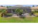 Screened in pool with hot tub, tropical plants, and outdoor seating area at 5550 Rock Dove Dr, Sarasota, FL 34241