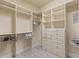Spacious walk-in closet with custom shelving and drawers providing ample storage space at 5550 Rock Dove Dr, Sarasota, FL 34241