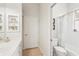 Bright bathroom with vanity, toilet and tub/shower combination with neutral accents at 614 Pond Willow Ln, Venice, FL 34292