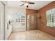 Spa-like bathroom featuring a glass shower, and light stone floors with natural light at 614 Pond Willow Ln, Venice, FL 34292