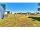 Large fenced backyard provides privacy and security, with ample space for gardening, play, or relaxation at 6392 Coliseum Blvd, Port Charlotte, FL 33981