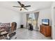 Bedroom with ceiling fan, neutral walls, wood-look floors, and good natural light at 6392 Coliseum Blvd, Port Charlotte, FL 33981