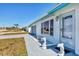 Well-kept home with decorative dolphin statues flanking the entrance and a neatly maintained lawn at 6392 Coliseum Blvd, Port Charlotte, FL 33981