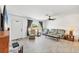 Bright living room with tile flooring, a ceiling fan, and comfortable seating arrangement at 6392 Coliseum Blvd, Port Charlotte, FL 33981
