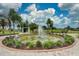 Community fountain with landscaping, and seating at 6639 Vista Ln, North Port, FL 34287