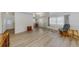 Bright living room with neutral walls and floors featuring natural light coming through the windows at 6639 Vista Ln, North Port, FL 34287