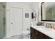 Clean bathroom featuring modern fixtures, a vanity with storage, and tiled floors at 7324 Links Ct, Sarasota, FL 34243