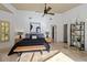 Bedroom featuring tile flooring, a ceiling fan, and great natural light at 7324 Links Ct, Sarasota, FL 34243
