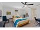 Sunlit bedroom with ceiling fan and large window at 7324 Links Ct, Sarasota, FL 34243