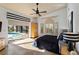 Bright bedroom with an exit to the pool, elegant furniture, and tiled floors at 7324 Links Ct, Sarasota, FL 34243