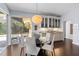 Dining area with view of the pool area and custom cabinets with display shelving at 7324 Links Ct, Sarasota, FL 34243