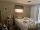 Bedroom with a comfortable bed and bright natural light at 733 Roma Rd, Venice, FL 34285