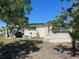 Charming home exterior featuring a well-maintained lawn, carport and lush landscaping at 733 Roma Rd, Venice, FL 34285
