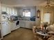 Functional kitchen area with standard appliances, ample cabinet space, and a casual dining area at 733 Roma Rd, Venice, FL 34285