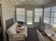 Enclosed sunroom with multiple windows offering lots of natural light at 733 Roma Rd, Venice, FL 34285