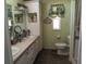 Bathroom with double sinks and decorative wall art at 805 S Waterway, Venice, FL 34285