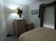 Bedroom featuring dresser and decoration near window at 805 S Waterway, Venice, FL 34285
