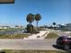 Charming community view showcasing lush palm trees, waterfront access, and serene neighborhood streets at 805 S Waterway, Venice, FL 34285