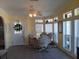 Bright dining area with tile floors, ceiling fan, and cozy seating, perfect for casual meals at 805 S Waterway, Venice, FL 34285