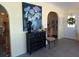 Inviting foyer with stylish decor, arched doorway, and elegant furnishings at 805 S Waterway, Venice, FL 34285