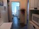 Hallway connecting to a bedroom and bathroom with tile flooring at 805 S Waterway, Venice, FL 34285