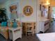 Living area with tile floors, coastal decor, and colorful furniture at 805 S Waterway, Venice, FL 34285