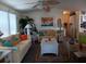 Bright living room featuring tile floors, coastal-themed decor, and comfortable seating at 805 S Waterway, Venice, FL 34285